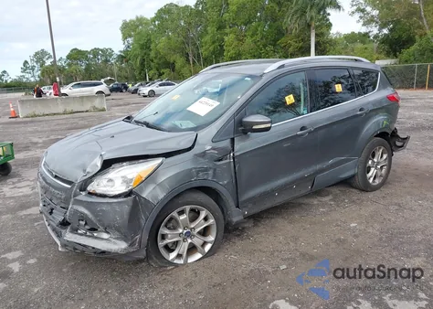 2014 Ford Escape Titanium z USA, uszkodzony, nr VIN 1FMCU9J92EUD41334